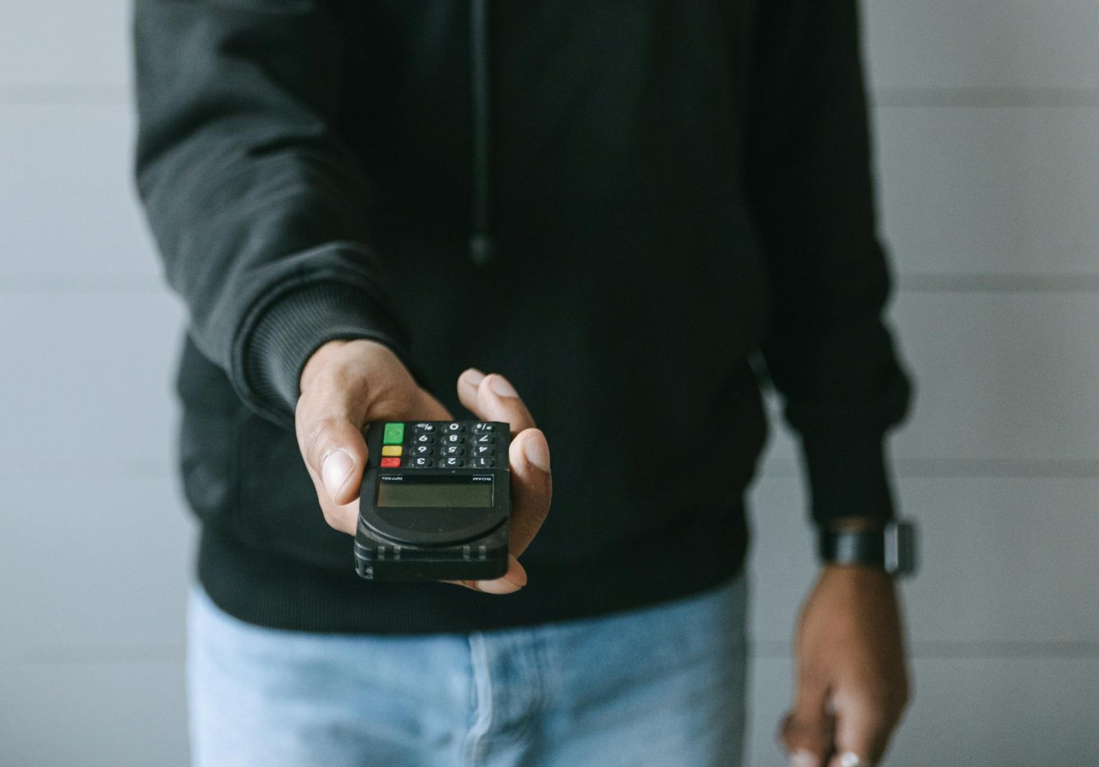 https://www.pexels.com/photo/person-in-black-long-sleeve-shirt-holding-black-smartphone-7621129/