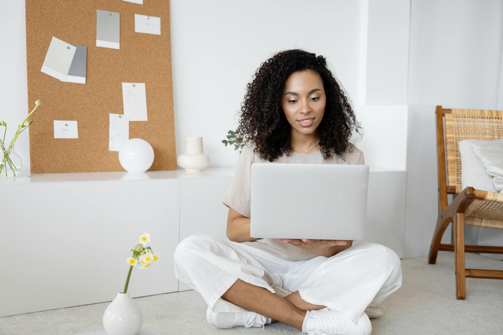 https://www.pexels.com/photo/woman-in-white-dress-shirt-and-white-pants-sitting-on-floor-using-macbook-7552374/