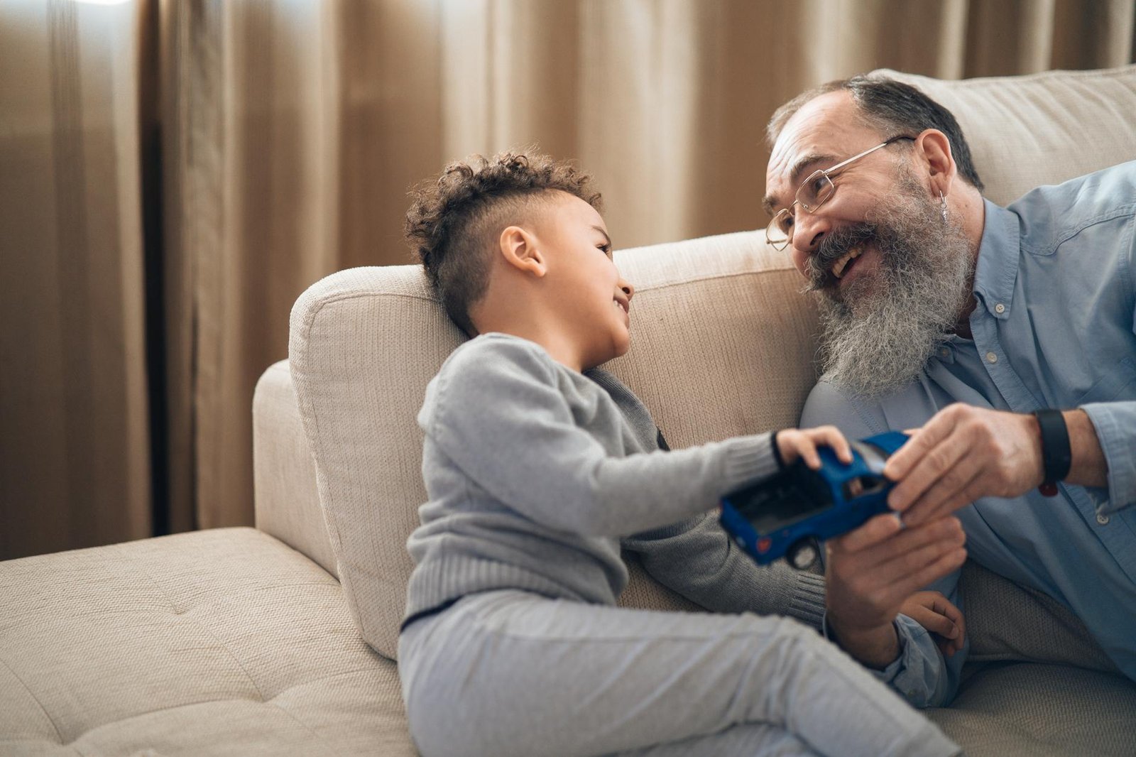 senior citizen playing with his child