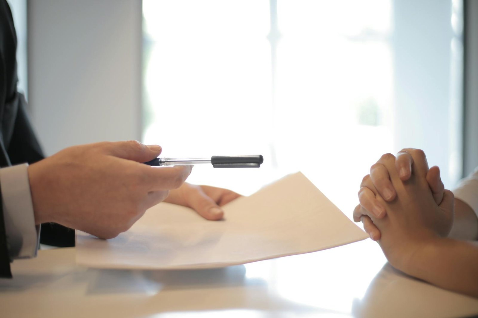 https://www.pexels.com/photo/crop-businessman-giving-contract-to-woman-to-sign-3760067/