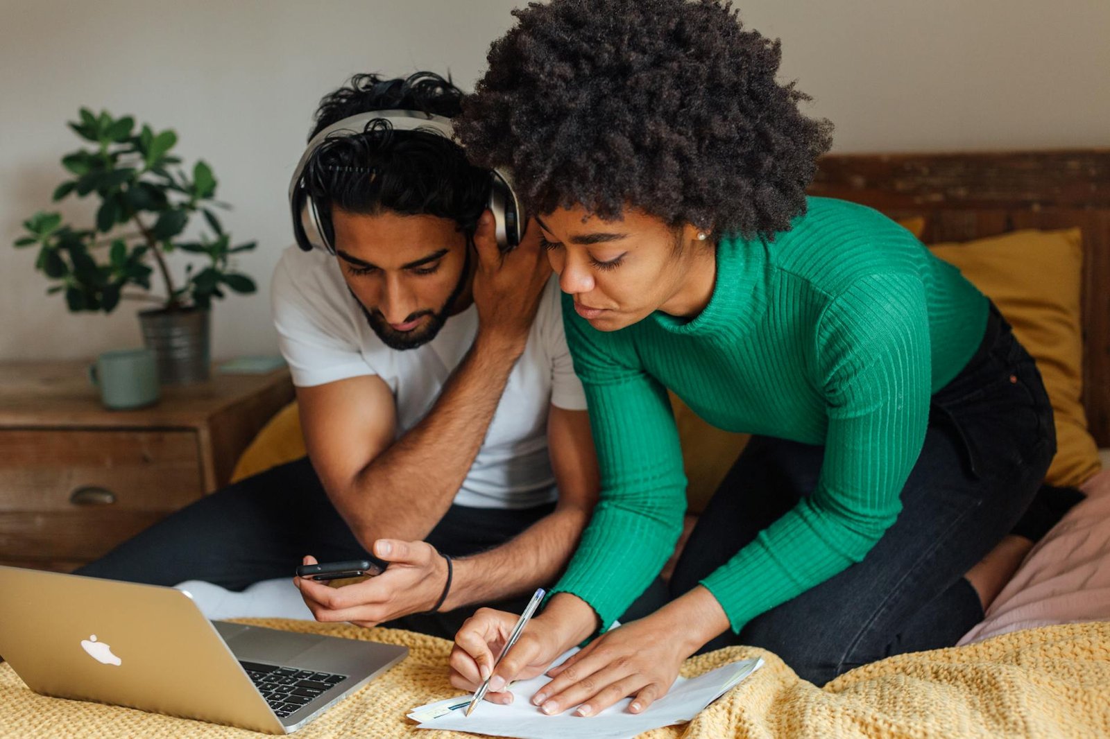 https://www.pexels.com/photo/woman-in-red-and-white-striped-long-sleeve-shirt-writing-on-white-paper-5332309/