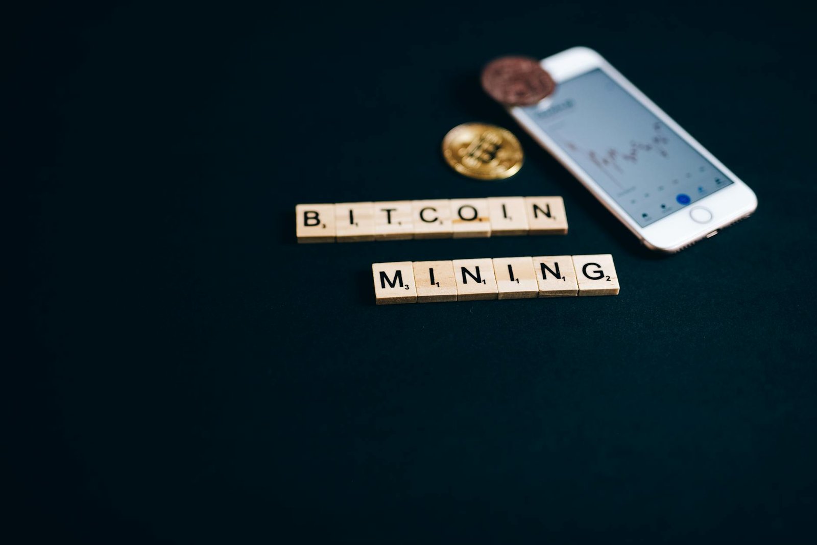 https://www.pexels.com/photo/bitcoin-mining-letter-tiles-near-an-iphone-8358036/